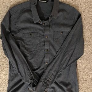 Two Travis Mathew button up casual shirts.